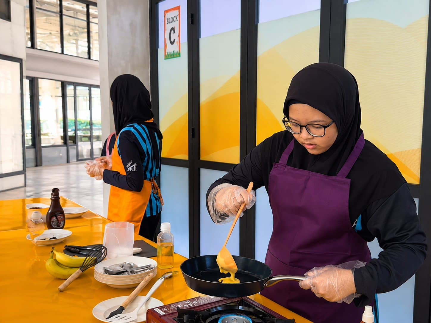 Student practising cooking as part of H.O.M.E life skills