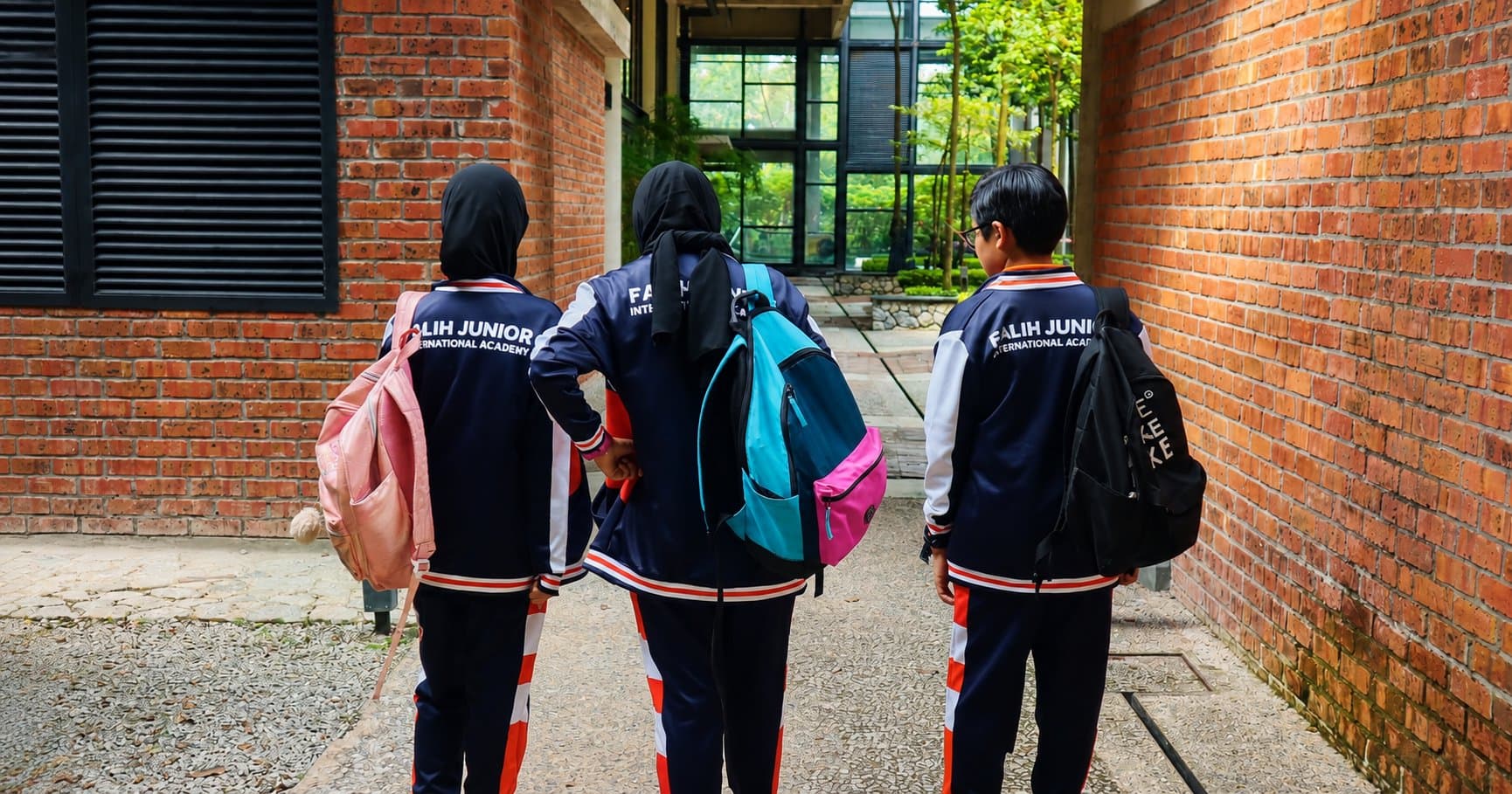 Falih Junior students walking through campus in Cyberjaya
