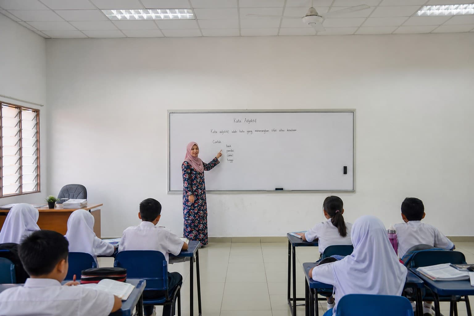 A Falih Junior teacher leading a classroom lesson